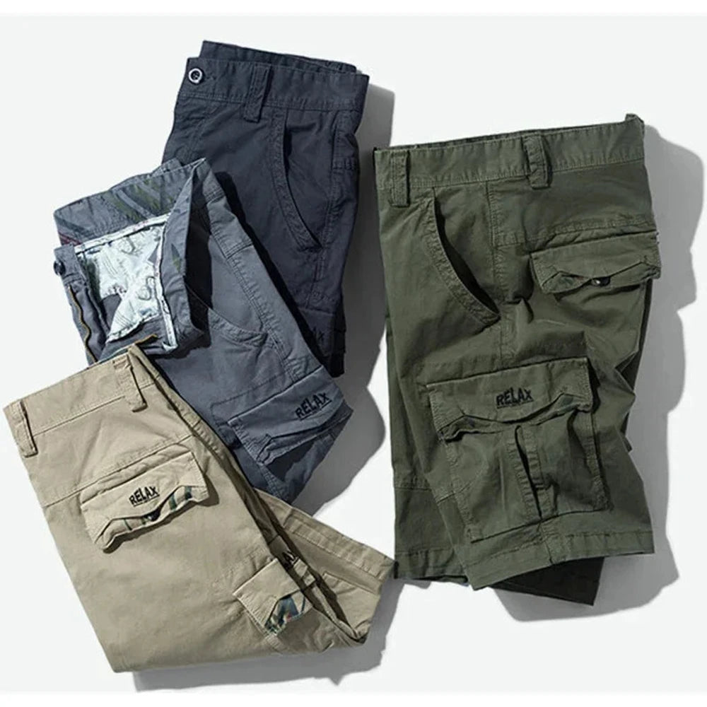 RELAX cargo shorts in dark grey, grey, khaki and army green folded and stacked together, RELAX embroidery showing on the khaki and army green flaps