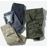 RELAX cargo shorts in dark grey, grey, khaki and army green folded and stacked together, RELAX embroidery showing on the khaki and army green flaps