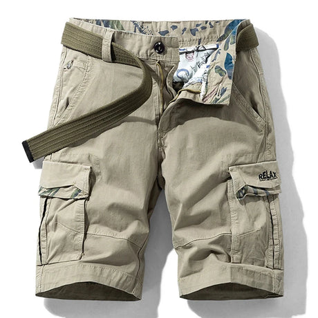 Khaki RELAX six-pocket cargo shorts laid flat, front view, fly open to show the printed inner waistband, with an olive webbing belt used for styling