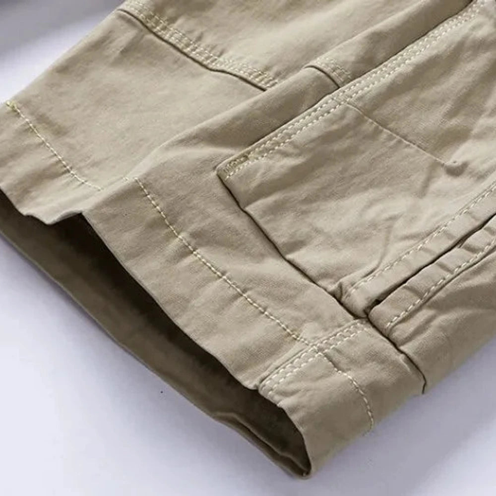 Close-up of the turn-up hem cuff with its darker contrast facing on the khaki RELAX shorts