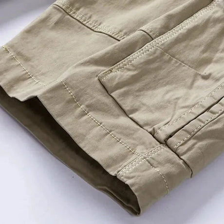 Close-up of the turn-up hem cuff with its darker contrast facing on the khaki RELAX shorts