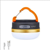 Small round camp lamp with an orange carabiner handle, a USB output port and its charging cable