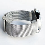 Silver mesh band fitted to a watch case, seen from the side with the clasp closed