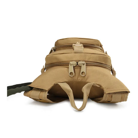 Top-down view of the tan hydration pack showing twin zips and the grab handle
