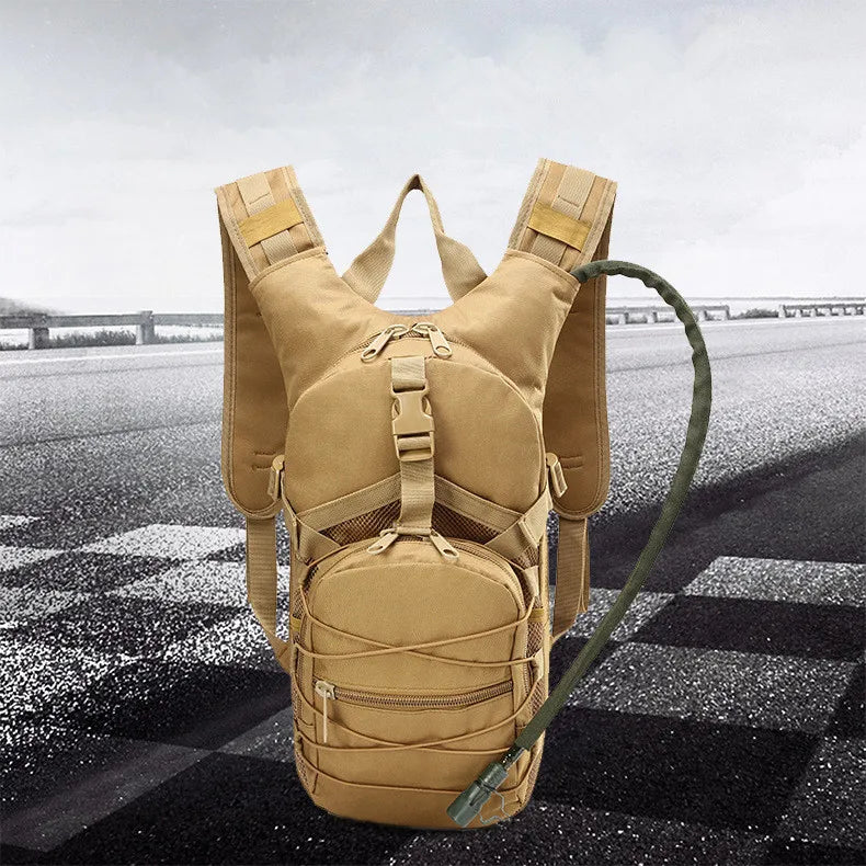 Tan hydration pack front view with drinking hose routed over the right shoulder strap