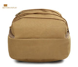 Bottom of the tan hydration pack showing the padded base and zip openings