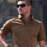 Man wearing the mud brown tactical polo shirt, chest and sleeves