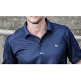 Close-up of the navy tactical polo collar, placket and chest emblem