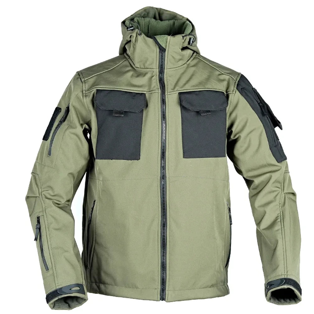 Green softshell jacket from the front, hood up, black chest pocket panels, zipped sleeve pockets and cuff tabs