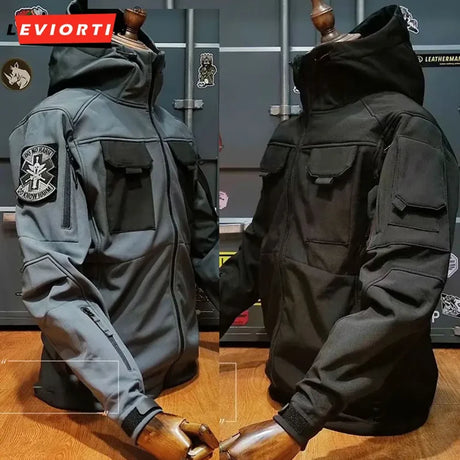 Grey and black softshell jackets on display stands, hoods up, showing chest pockets and cuff tabs; patch not included
