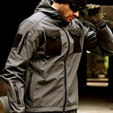 Man in the grey softshell jacket with black chest pockets; beanie, sunglasses, watch, gloves, trousers not included