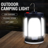 Tall camping lantern glowing on a timber table, with a wire hook on top