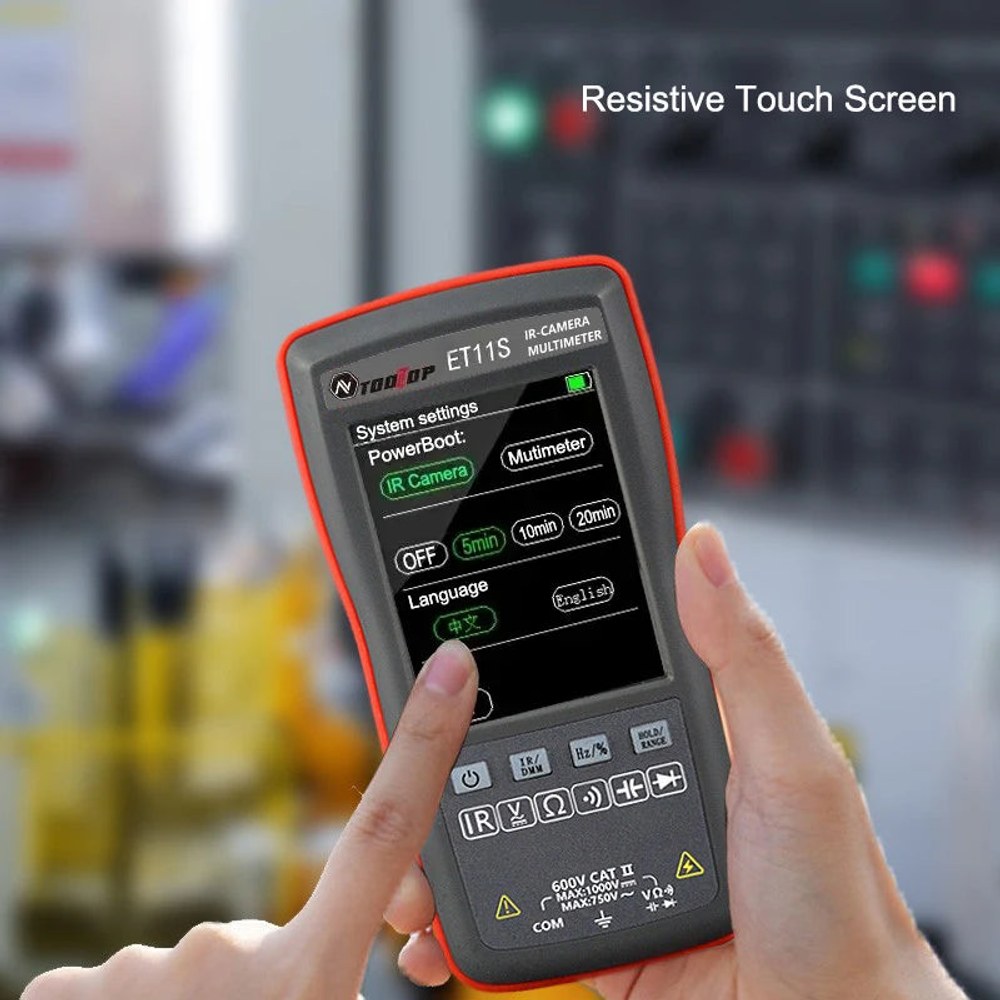 Hand holding the ET11S with the settings menu open on its resistive touch screen