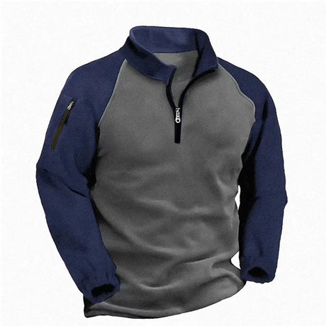 Half-zip fleece pullover with dark blue sleeves and collar on a grey body
