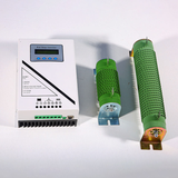 Flat lay of the WCMD controller with its terminal strip and heatsink visible, beside the 800 W and 2 kW green dump-load resistors.