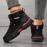 Black hiking boot from the back and side: heel pull loop, mesh collar and rose red sole strip