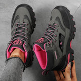 Grey and rose red hiking boots from above, showing the laces, mesh tongue, padded collar and rose red lining