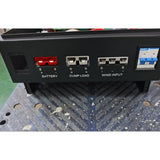 Terminal panel of the WW50 pure-wind controller: red Anderson battery connectors, dump load and three-phase wind input plugs, and a CHINT circuit breaker