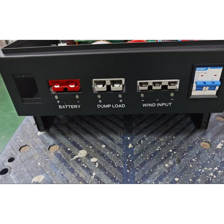 Terminal panel of the WW50 pure-wind controller: red Anderson battery connectors, dump load and three-phase wind input plugs, and a CHINT circuit breaker