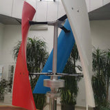 X-series helical turbine displayed indoors among potted palms with one red, one white and one blue blade - a supplier display unit; BushLine stocks the white version.