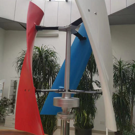 X-series helical turbine displayed indoors among potted palms with one red, one white and one blue blade - a supplier display unit; BushLine stocks the white version.