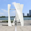 X-300 three-blade helical vertical-axis wind turbine on a white pole, white blades and alloy hub, in front of a lake and city skyline - representative X-series photo.