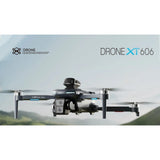 XT606 folding GPS drone in flight with its dual camera on the front