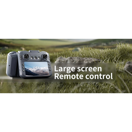 XT606 remote control with its own built-in screen, sitting on grass