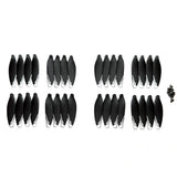 Thirty-two black XT606 drone propellers with white tips and their mounting screws