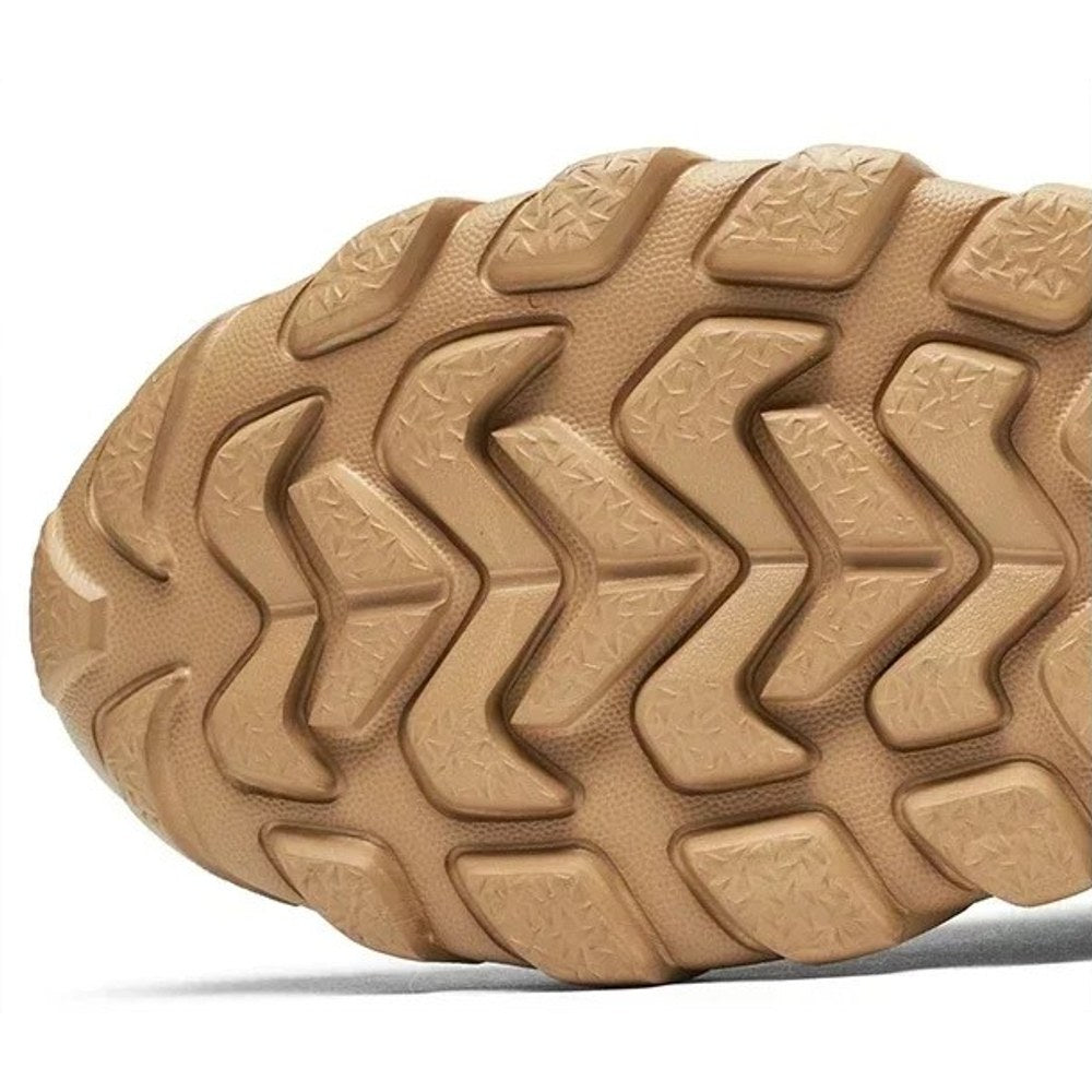 Underside of the sand boot showing the deep chevron lug tread on the EVA outsole
