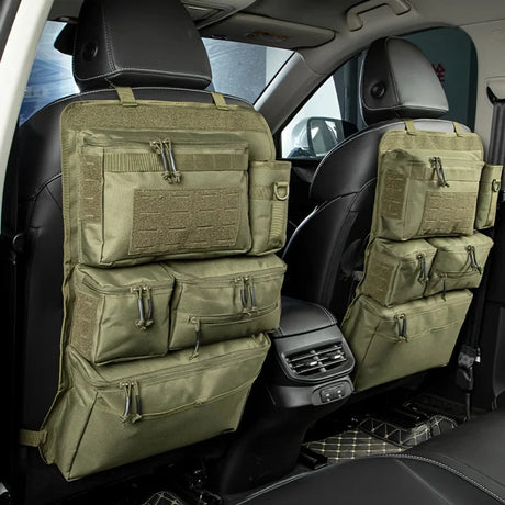 Two army green zipped seat back organisers on the front seats of a car