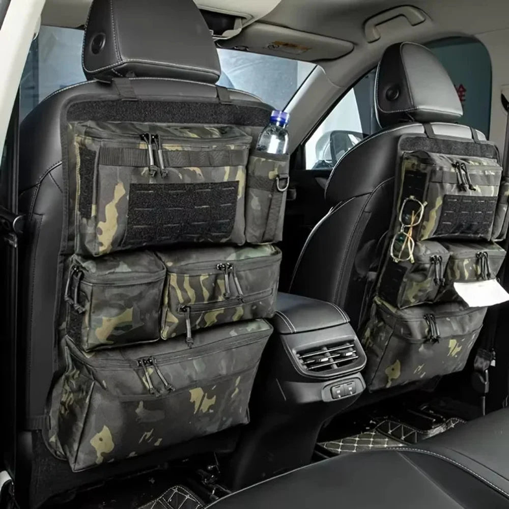 Two black camo zipped seat back organisers hung on the front seats of a car, a water bottle in the side sleeve
