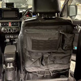 Black zipped seat back organiser strapped around the headrest of a right-hand-drive 4WD's front seat