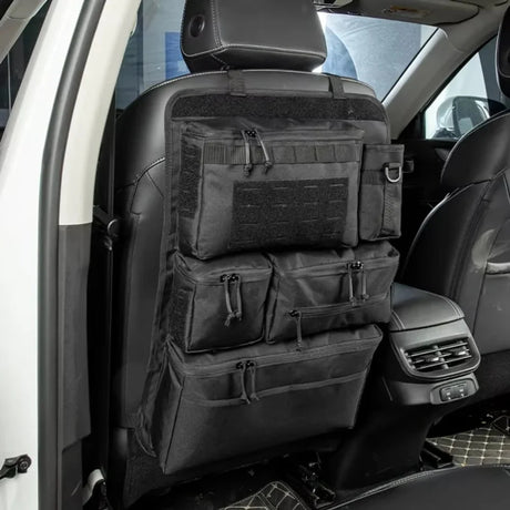 Black zipped seat back organiser strapped over a car front seat