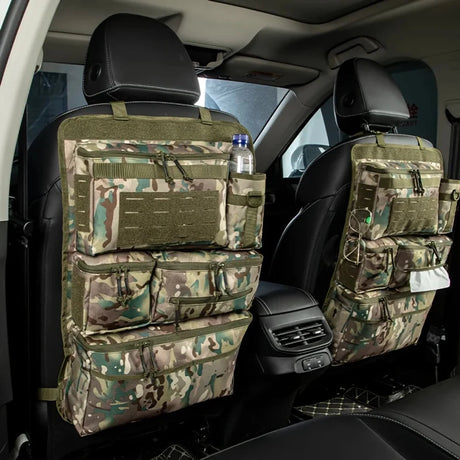 Two CP camo zipped seat back organisers on the front seats of a car, a bottle in the side sleeve