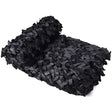Black camouflage netting folded into a roll on a white background, showing the dense cut fabric mesh