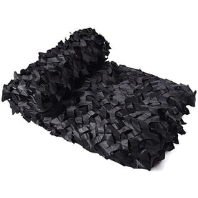 Black camouflage netting folded into a roll on a white background, showing the dense cut fabric mesh