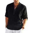 Black band collar shirt on a model, sleeves rolled up, worn loose over white trousers