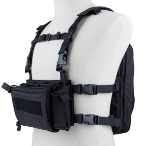 Black chest rig and flatpack worn on a mannequin, harness straps and buckles visible