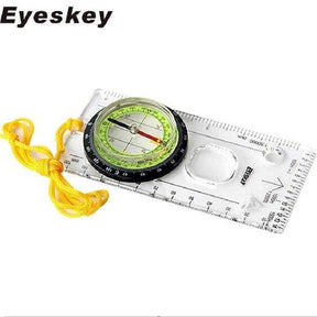 Eyeskey branded shot of the green-dial compass with its yellow neck lanyard