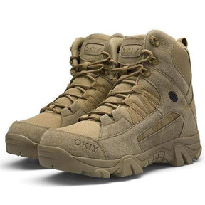 Pair of sand boots side by side on white, angled, laces threaded through fabric loops