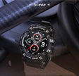 Black watch resting on a car interior, colour dial showing steps and calories