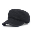 Black flat-top cadet cap at a three-quarter angle, showing the flat crown and stitched panel seams