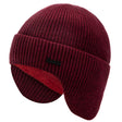 Red wool beanie from the side with the earflaps down, contrasting red fleece lining visible inside