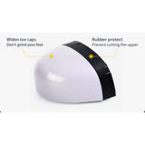 White plastic toe cap with a black rubber edge, the cap fitted inside the boot
